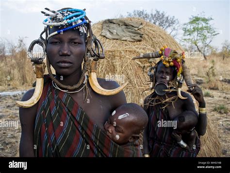 Women And Children Belonging To The Mursi Tribe Ethiopia Stock Photo
