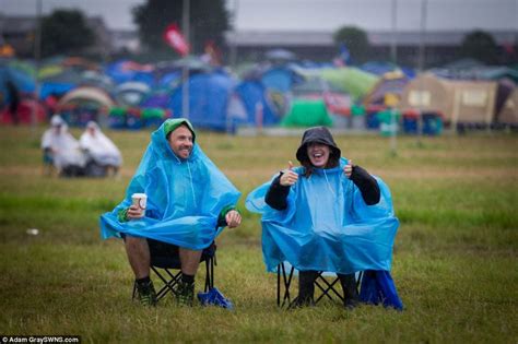 Let It Rain Revellers At Glastonbury Donned Ponchos And Sat In The Open Air As A Thunderous