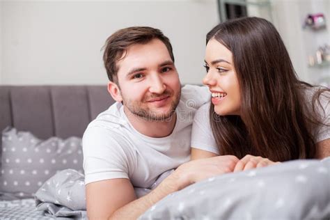 Happy Sensual Young Couple Lying In Bed Together Stock Image Image