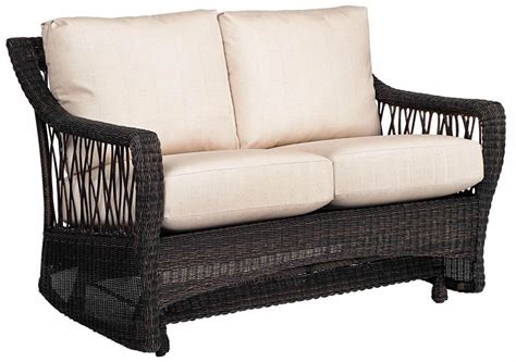 Indoor wicker furniture, usually constructed of natural rattan, is available in dining sets, sofas, rockers, gliders and more. WhiteCraft by Woodard Serengeti Wicker Loveseat Glider ...