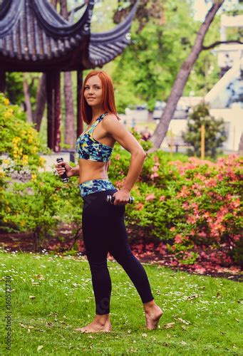 Full Body Image Of Sporty Redhead Female With Dumbbells Buy This