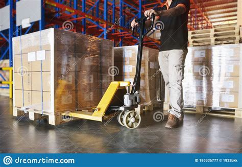 Shipment Cargo In Factory Warehouse Worker Working With Hand Pallet Truck Stock Image Image