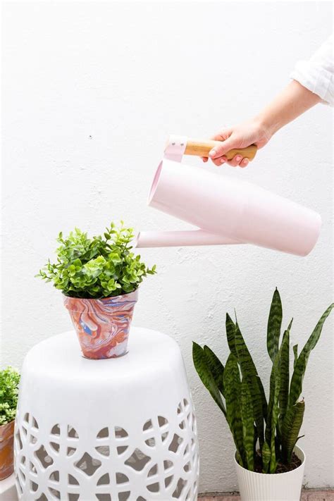 How To Create Diy Marbled Planters With Nail Polish