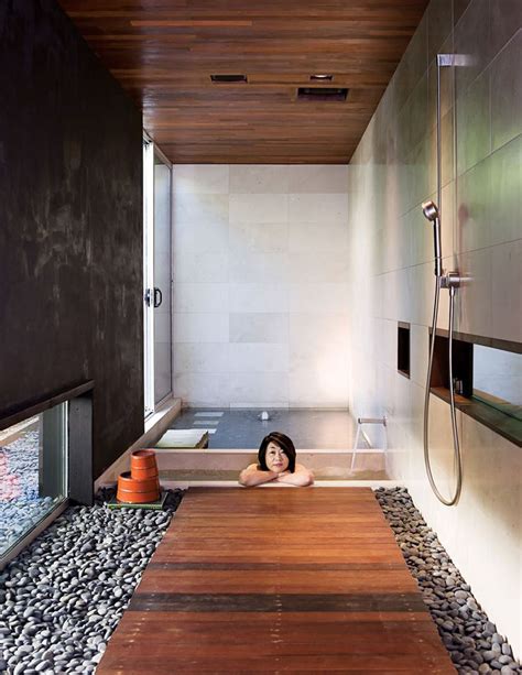 Japanese Style Bathroom With Small Soaking Tub And Wood Flooring