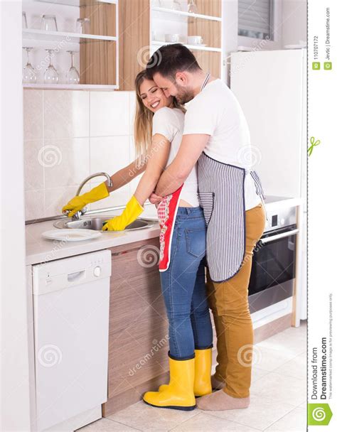 Young Couple Hugging In Kitchen Stock Photo Image Of House Casual