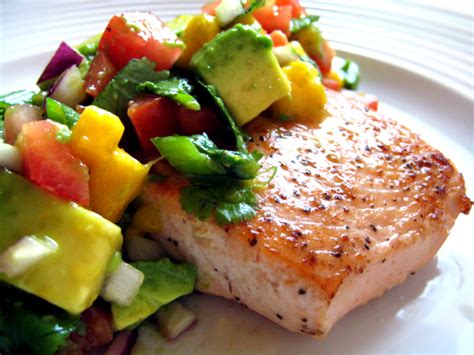 In a medium bowl, combine the mango, avocado, tomatoes, jalapeno, cilantro, and garlic. Salmon with Avocado Mango Salsa recipe - Canyon Ranch ...