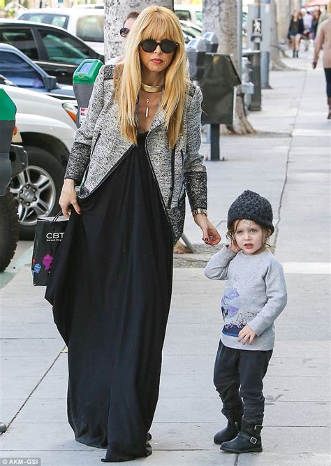 rachel zoe sports loose fitting black dress and chic blazer for day out with son skyler two