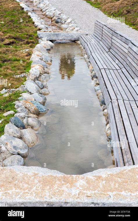 Artificial Creek In The Mountain With Bench And Stones Stock Photo Alamy