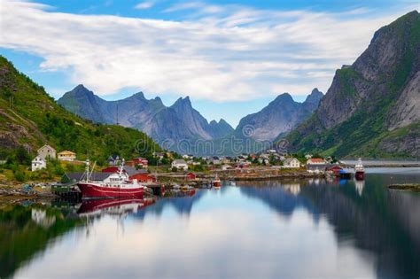 Reine Village With Fishing Boats And Mountains On Lofoten Islands