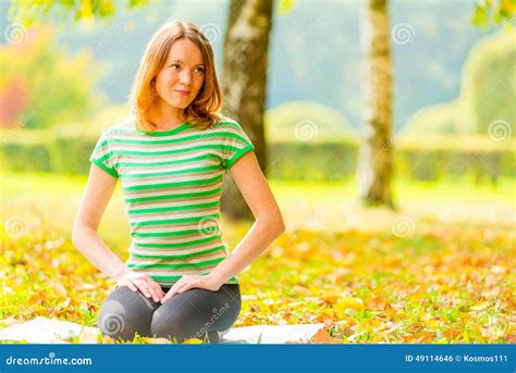Girl With Brown Eyes Resting On The Grass Stock Photo Image Of Park