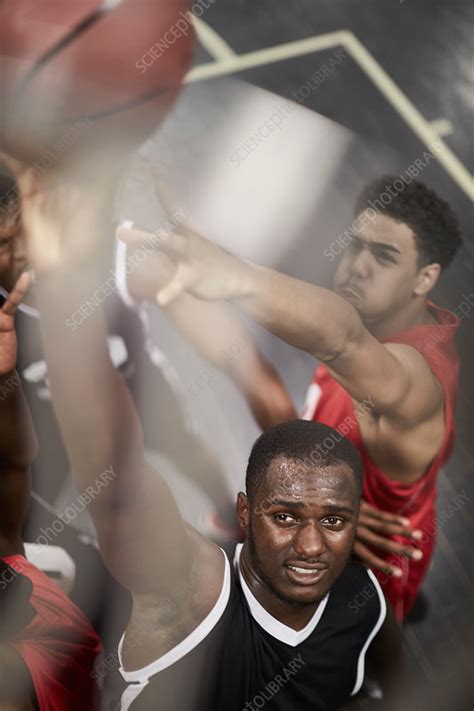 Determined Basketball Player Dunking The Ball Stock Image F Science Photo Library