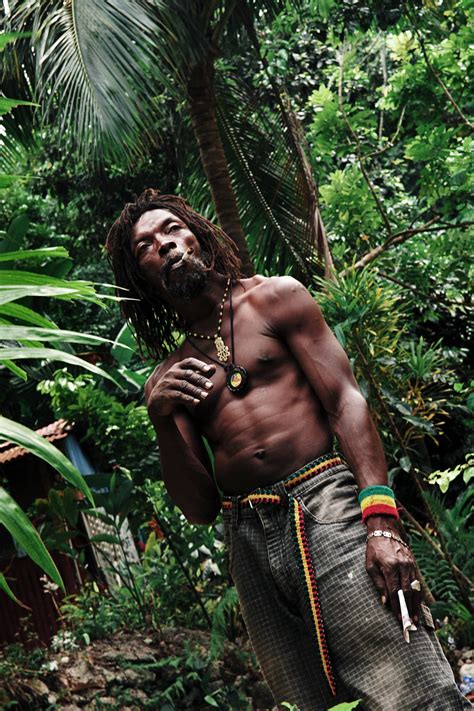 Rastafarian Near Kingston Jamaica Explaining His Philosophy And Inhaling In Between