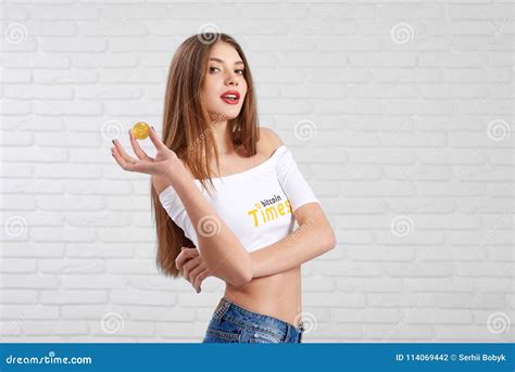 Gorgeous Young Caucasian In White Crop Top With Bitcoin Logo Posing