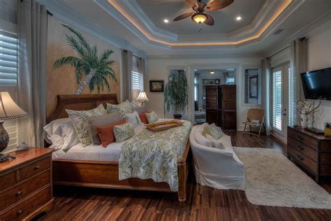 Tropical Master Bedroom With Flush Light Hardwood Floors Mural Crown