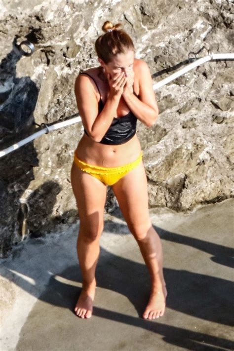 Emma Watson Spotted In A Black Crop Top And Yellow Bikini Bottoms While Enjoying The Sun At A