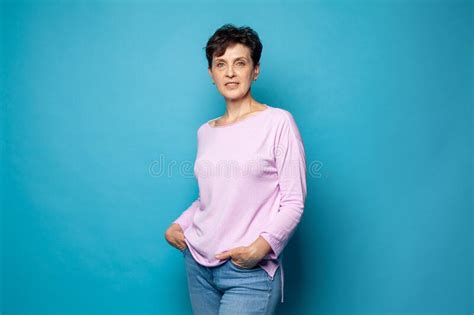 Happy Smiling Mature Woman Brunette With Short Hair Holding Pink Eight