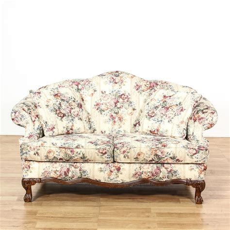 This Cottage Chic Loveseat Is Upholstered In An Off White Cream Fabric