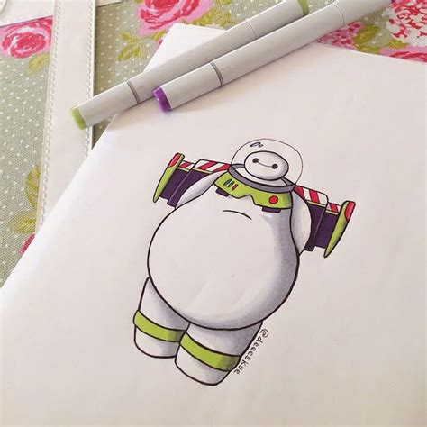 A Drawing Of A Cartoon Character Is Shown On A Piece Of Paper Next To A Ballpoint Pen
