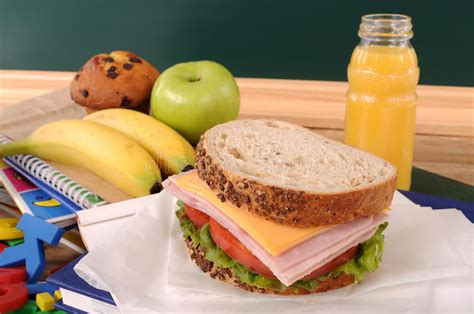 School Packed Lunch Ham And Cheese Sandwich On Classroom