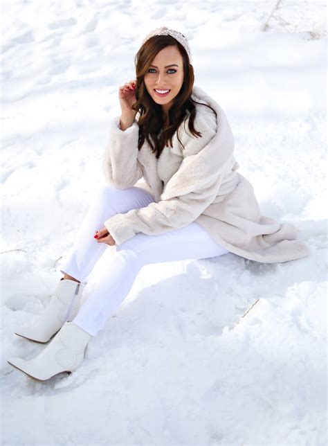Sydne Style Shows How To Wear Winter White In Faux Fur Coat And White