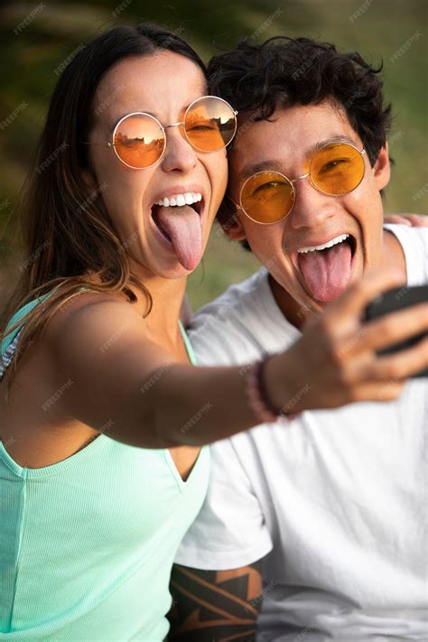 Free Photo Couple Taking A Selfie While Traveling In Summer