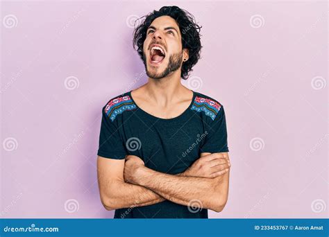 Handsome Hispanic Man With Arms Crossed Gesture Angry And Mad Screaming