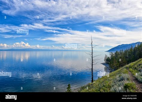 Baikal Landscape Deep Blue Lake And Siberian Mountains On Horizon