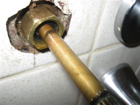 What causes a leaky faucet? Hot water faucet leaking in the bathtub.