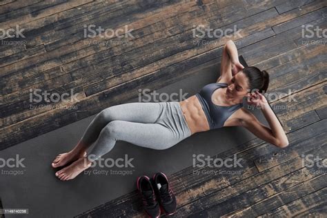 Stylish Wooden Floor Top View Of Girl With Slender Body Works On The
