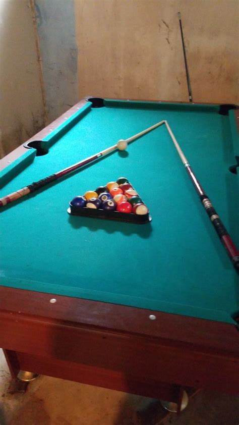 Standard method open the tape measure and place the end of the tape measure at the edge of the cushion of the pool table. Full pool table. 2 sticks all balls no holes in pockets ...