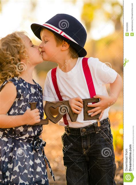Suck, slowly kiss and lick his earlobes. Boy kissing girl stock photo. Image of love, curly, lips ...