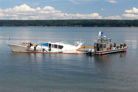 Tanner broadwell and nikki walsh (inset) on their sailboat. 'Silver Lining' yacht partially sinks in Hood Canal ...