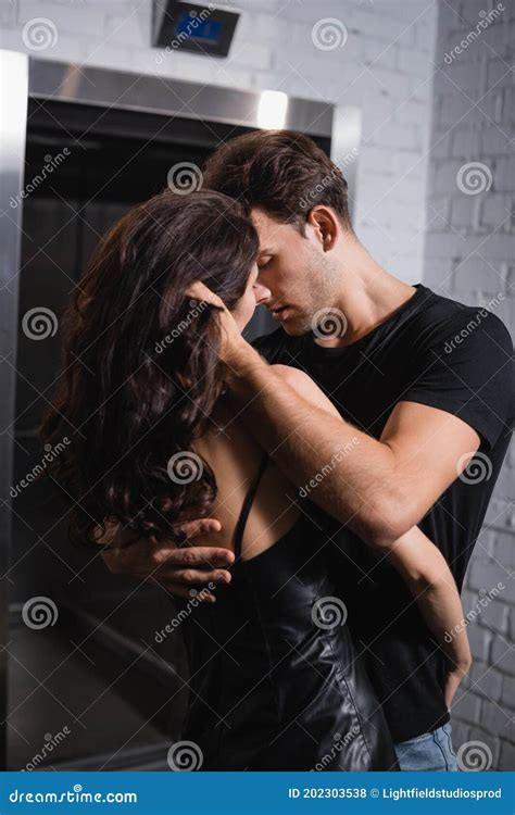 Man Embracing Woman While Touching Stock Photo Image Of Curly Macho