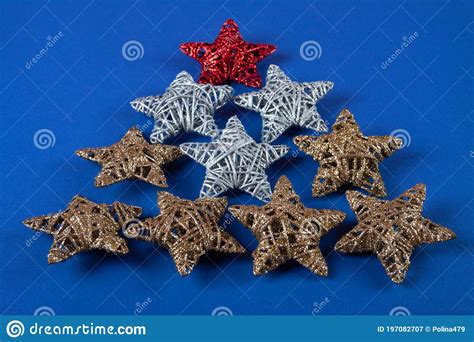 Brilliant Red Gold Silver Christmas Star On Blue Background Stock