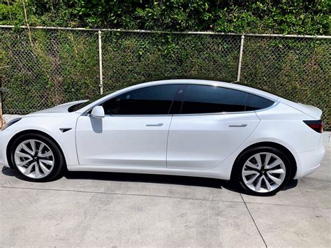 White Tesla Model 3 With 30 Tinted Side Windows Tesla Model 3 Wiki