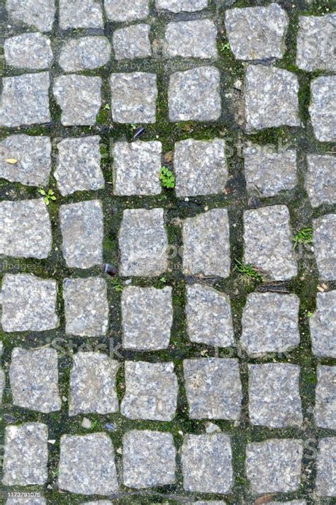 Abstract Background Of Very Old Cobblestone Pavement View From Above