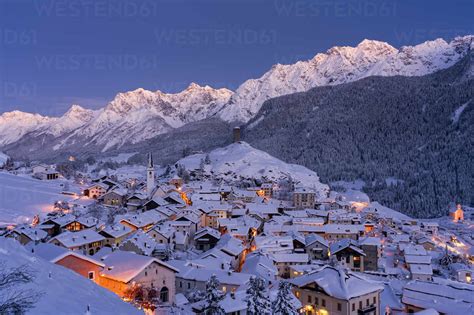 Traditional Houses Covered With Snow During The Winter Dusk Ardez