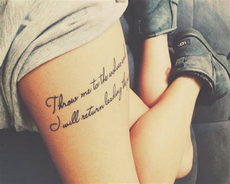 thigh tattoo saying throw me to the wolves and i will return leading the pack on despoina