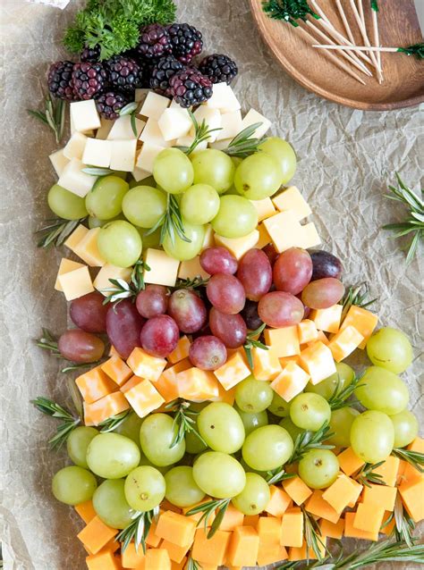 Start at the bottom and work your way up: Christmas Tree Fruit & Cheese Platter | YellowBlissRoad.com