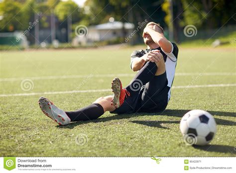 Injured Football Player On Field. Stock Photo | CartoonDealer.com #71129178