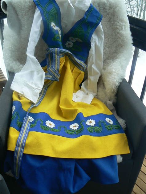 swedish national costume consisting of a hand embroidered apron dress and blouse the dress is