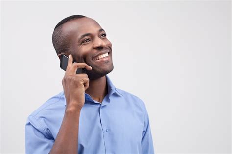 Premium Photo Man On The Phone Cheerful Black Man Talking On The Mobile Phone And Smiling
