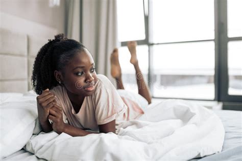Sad Depressed Woman Lying In Bed Stock Photo Image Of Afro