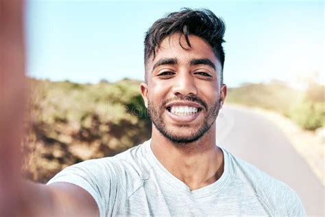 Closeup Fit Mixed Race Man Taking A Selfie While Out For A Run