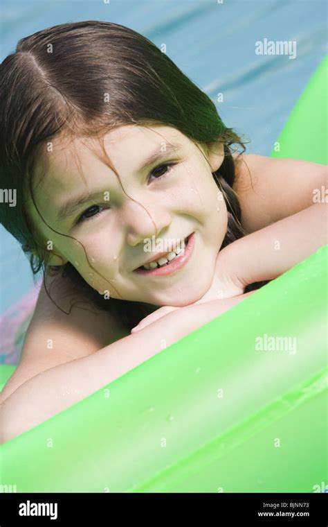 Girl On Floatation Device Stock Photo Alamy