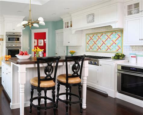 White painted kitchen cabinets with colorful backsplash and separated