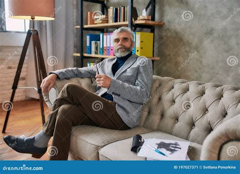 The Best Counseling Portrait Of Mature Psychologist Looking At Camera
