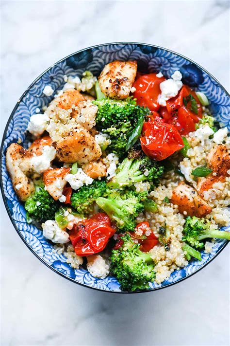 Chicken breast, avocado, feta, corn, tomatoes and spinach on a bed of fluffy quinoa. Mediterranean Chicken Quinoa Bowl Recipe | foodiecrush.com