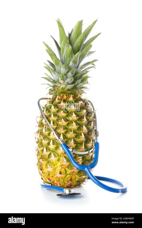 Fresh Pineapple With Stethoscope On White Background Stock Photo Alamy