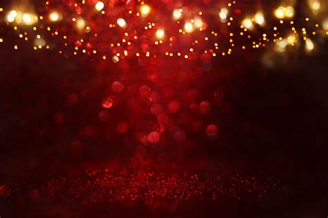 Red Black And Gold Glitter Lights Background Defocused Stock Photo
